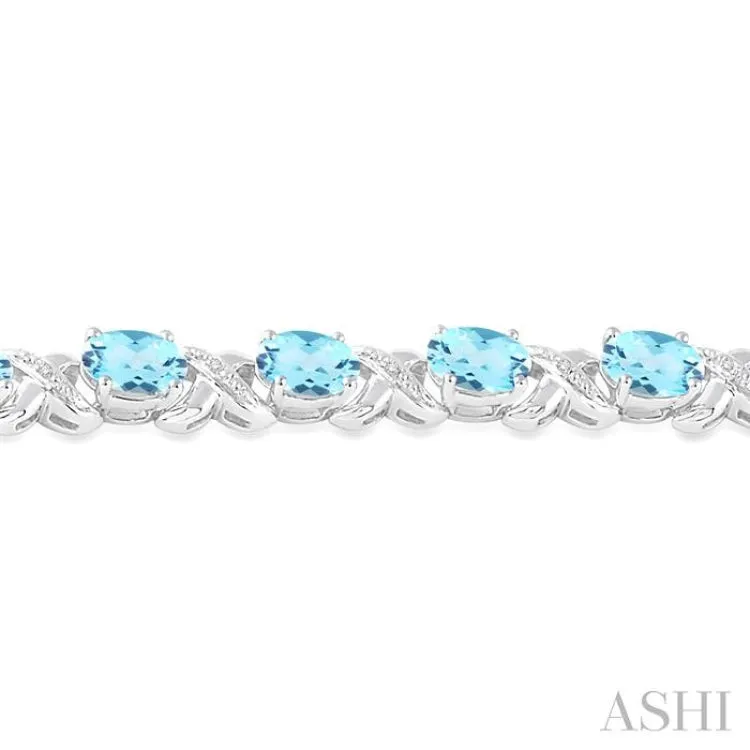 7x5  MM Oval Cut Blue Topaz and 1/20 ctw Round Cut Diamond Fashion Bracelet in Sterling Silver