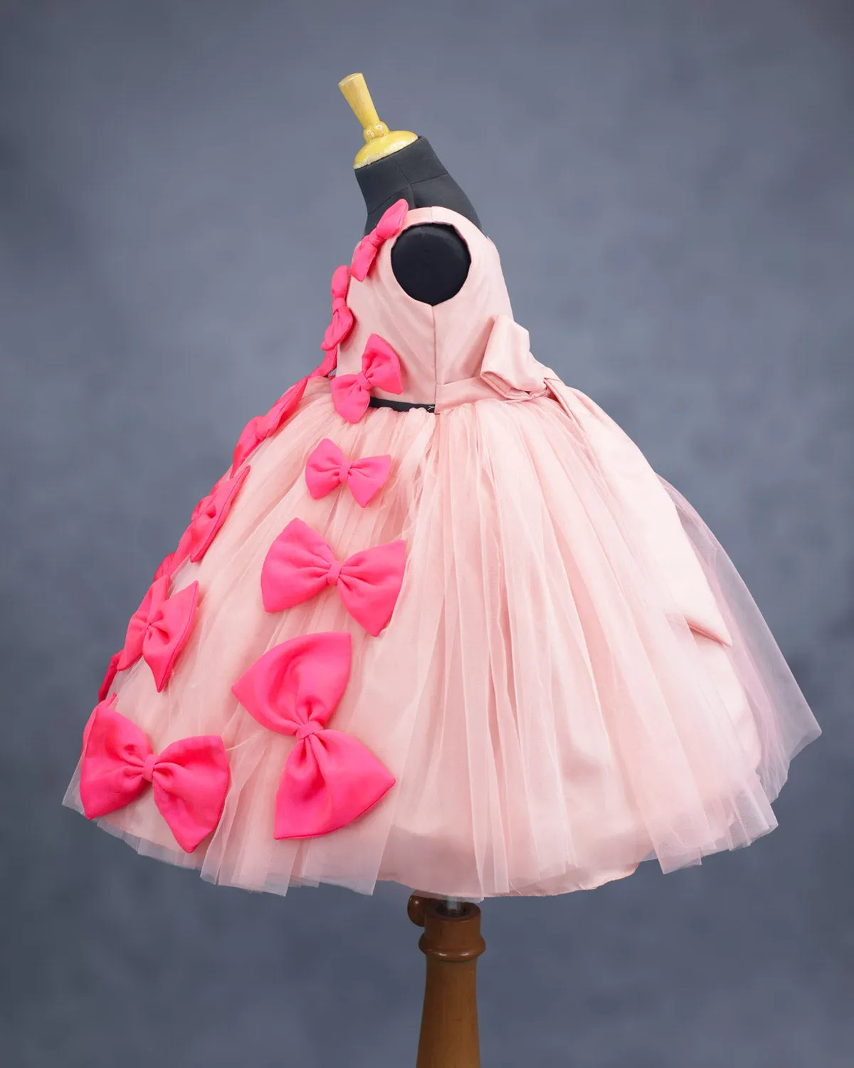 Peach and coral pink bow design gown